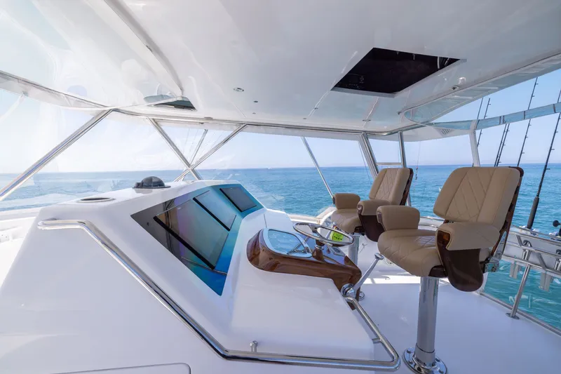 Slide: The Image of Luxurious helm of a 2001 Viking 55 Convertible yacht with ocean view. - 13