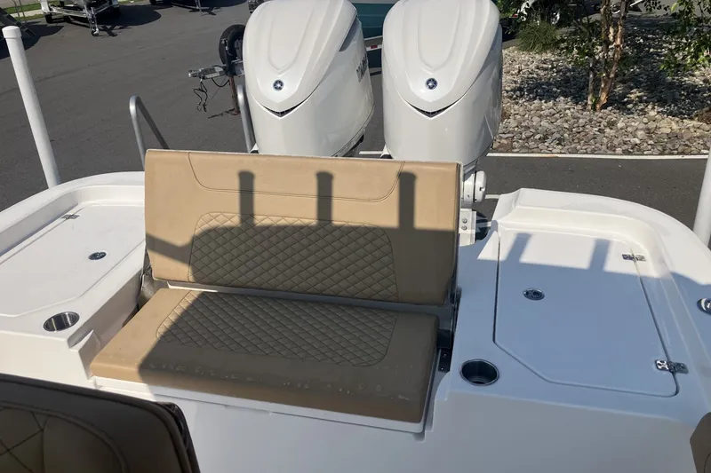 Slide: The Image of 2027 Caymas 291 boat with dual engines and tan quilted seating. - 20