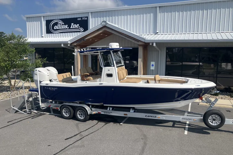 Slide: The Image of 2027 Caymas 291 boat on trailer outside Collins Inc. building. - 8