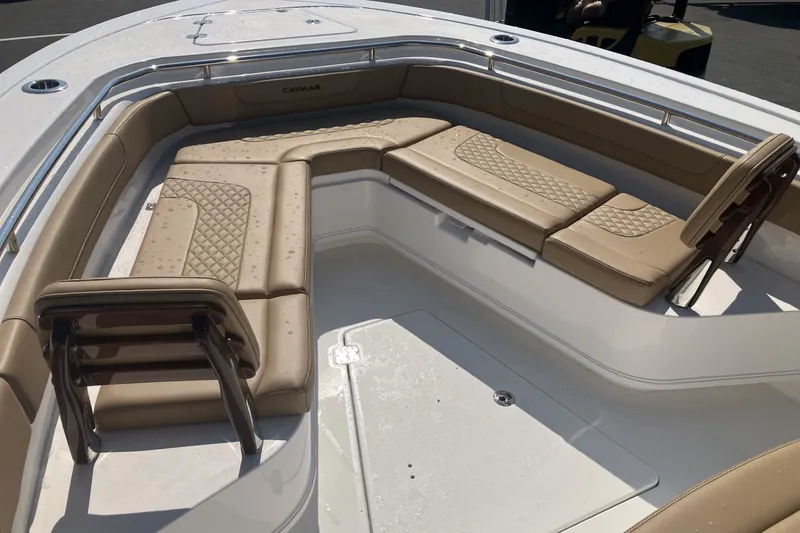 Slide: The Image of Luxurious seating on 2027 Caymas 291 boat, featuring tan upholstery and diamond stitching. - 16