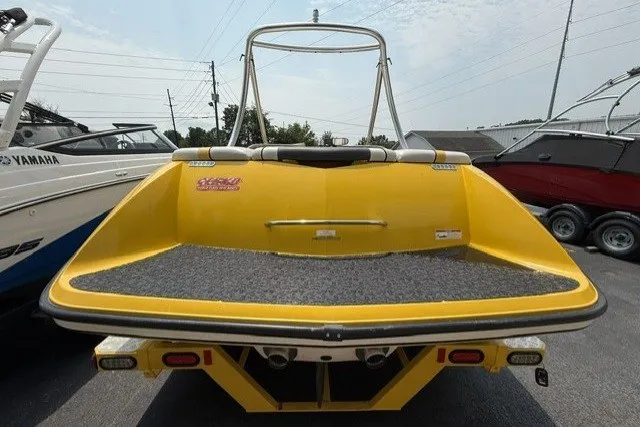Slide: The Image of Yellow 2009 Gekko Revo boat rear view, parked on a trailer. - 3
