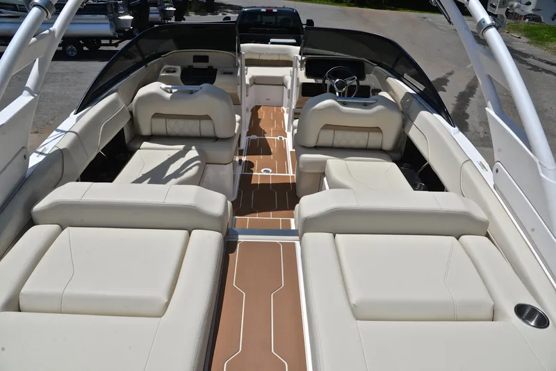 Slide: The Image of 2020 Regal LS2 Surf boat interior with luxurious beige seating and sleek design. - 19