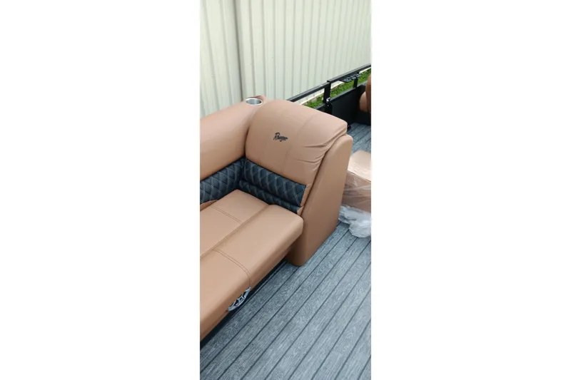 Slide: The Image of Tan leather seating on 2026 Ranger 220F boat deck, featuring quilted accents. - 14