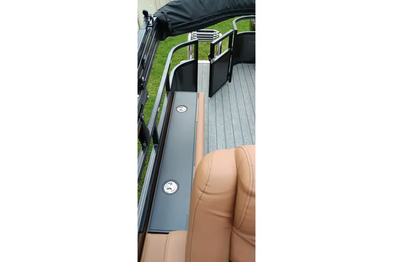 Slide: The Image of 2026 Ranger 220F boat interior with tan seating and sleek black railing. - 31