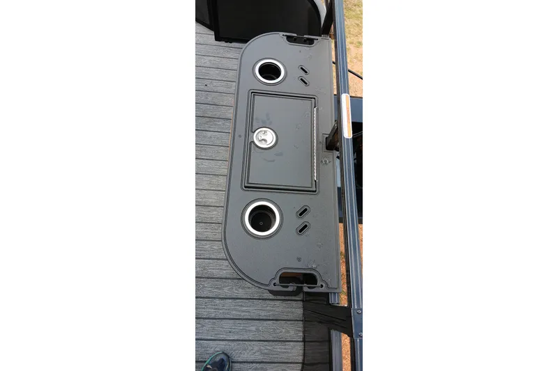 Slide: The Image of Ranger 220F 2026 boat deck with cup holders and storage compartment. - 13