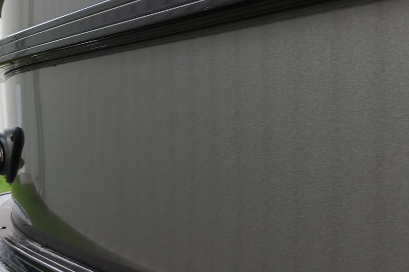 Slide: The Image of Close-up of 2026 Ranger 220F boat's sleek, gray exterior surface. - 7