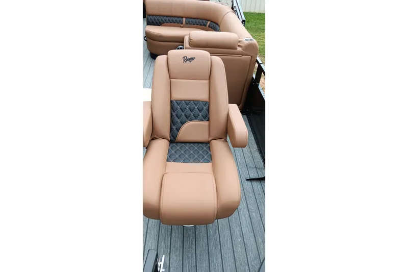 Slide: The Image of Luxurious tan seating on 2026 Ranger 220F boat, featuring diamond-patterned accents. - 27