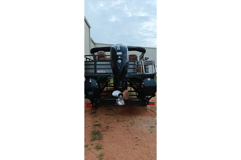 Slide: The Image of Rear view of 2026 Ranger 220F boat with outboard motor on trailer. - 3