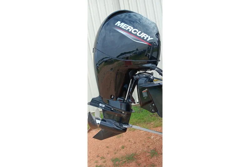 Slide: The Image of Mercury outboard motor on 2026 Ranger 220F boat, displayed outdoors. - 2