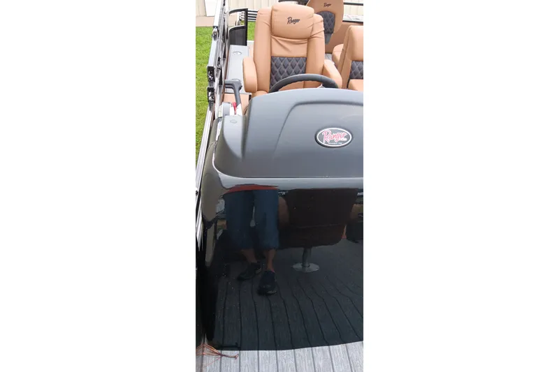 Slide: The Image of 2026 Ranger 220F boat interior with tan and black seating, featuring Ranger logo. - 32
