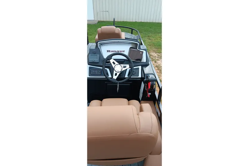 Slide: The Image of Interior view of 2026 Ranger 220F boat with steering wheel and dashboard. - 17