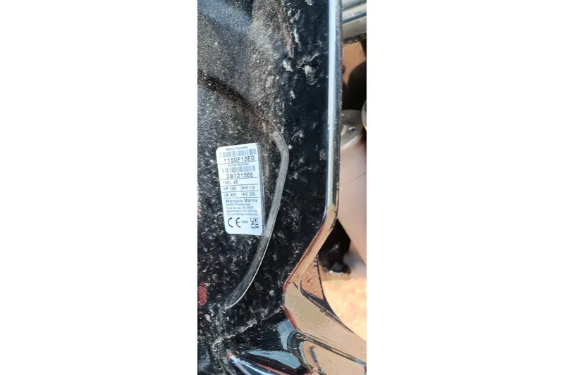 Slide: The Image of Close-up of a 2026 Ranger 220F label on a dusty surface. - 35