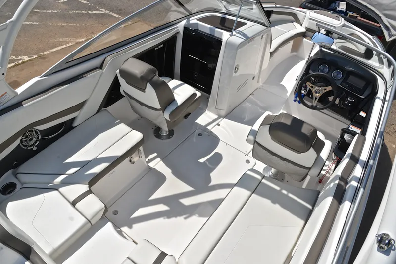 Slide: The Image of 2015 Yamaha Boats 242 Limited S interior with sleek seating and modern dashboard. - 18