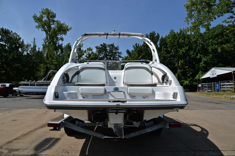 Slide: The Image of 2015 Yamaha Boats 242 Limited S on trailer, rear view, outdoors, sunny day. - 12