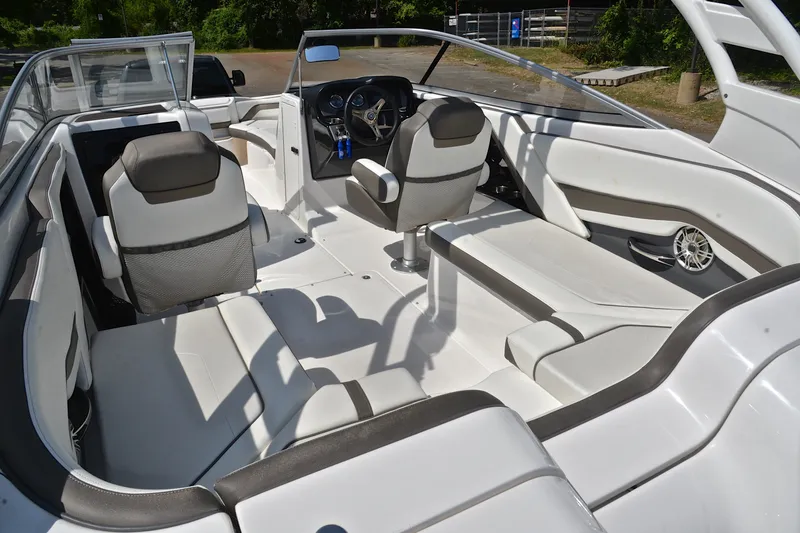 Slide: The Image of 2015 Yamaha Boats 242 Limited S interior with sleek seating and modern dashboard design. - 23