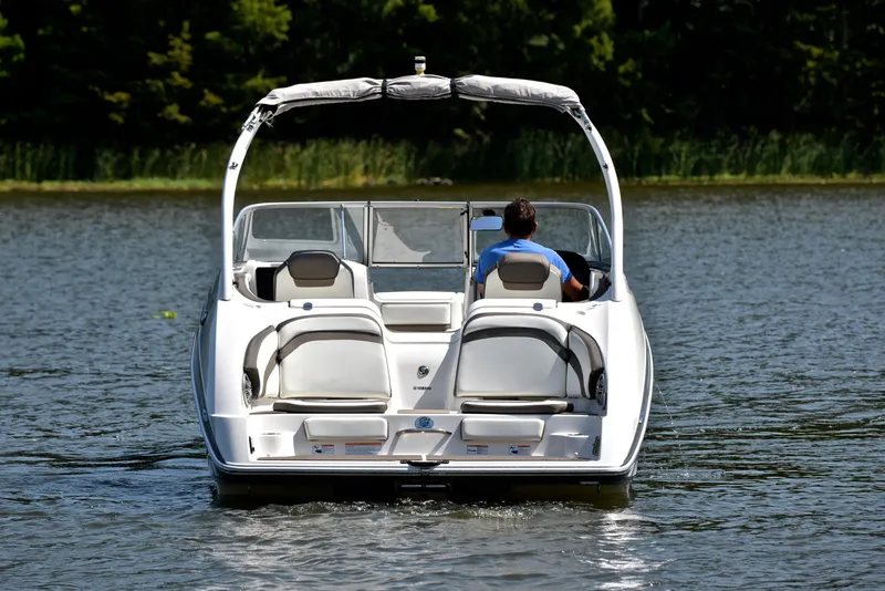 Slide: The Image of 2015 Yamaha Boats 242 Limited S cruising on a serene lake. - 7