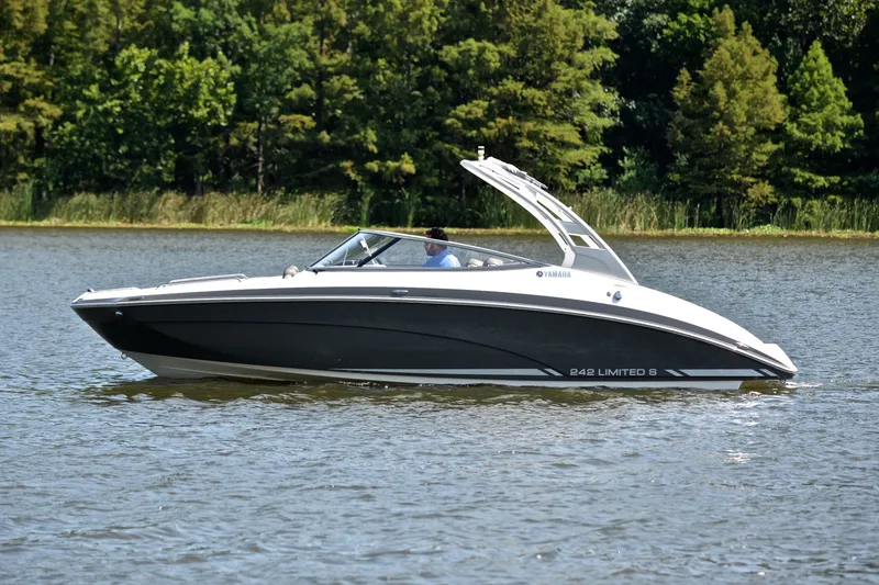 Slide: The Image of 2015 Yamaha Boats 242 Limited S cruising on a serene lake. - 8