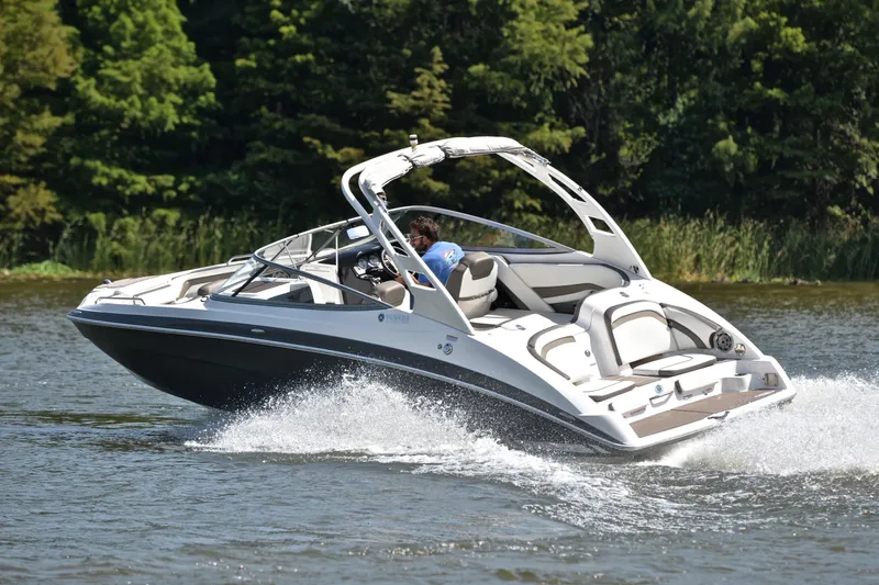 Slide: The Image of 2015 Yamaha Boats 242 Limited S cruising on a scenic lake. - 6