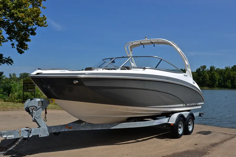 Slide: The Image of 2015 Yamaha Boats 242 Limited S on trailer by a lake. - 9