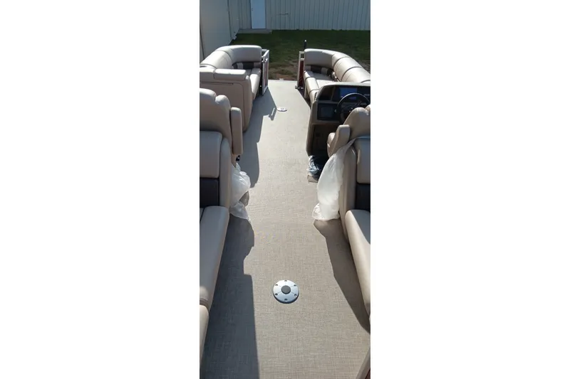 Slide: The Image of 2025 Sun Tracker Party Barge 24 DLX interior with spacious seating and modern design. - 5