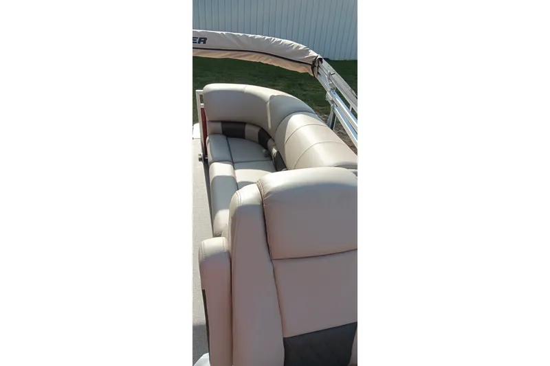 Slide: The Image of 2025 Sun Tracker Party Barge 24 DLX with beige seating and railing. - 24
