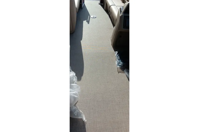 Slide: The Image of 2025 Sun Tracker Party Barge 24 DLX interior flooring, showcasing spacious and comfortable design. - 15