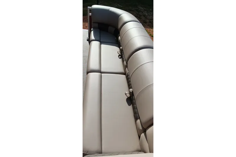 Slide: The Image of 2025 Sun Tracker Party Barge 24 DLX boat seating, featuring comfortable, sleek gray upholstery. - 12