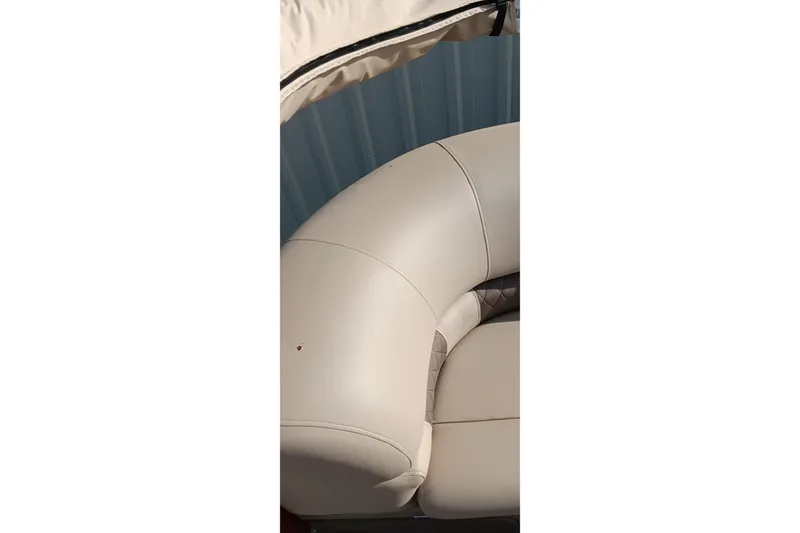 Slide: The Image of 2025 Sun Tracker Party Barge 24 DLX beige seating detail with canopy. - 13