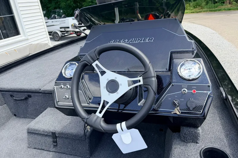 Slide: The Image of Steering console of 2027 Crestliner XF 189 boat with gauges and controls. - 5