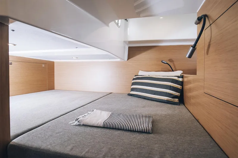 Slide: The Image of Manufacturer Provided Image: 2026 Beneteau Flyer 10 cabin interior with cozy bed and modern lighting. - 6