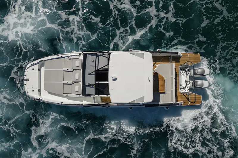 Slide: The Image of Manufacturer Provided Image: Aerial view of 2026 Beneteau Flyer 10 motorboat navigating through ocean waves. - 3