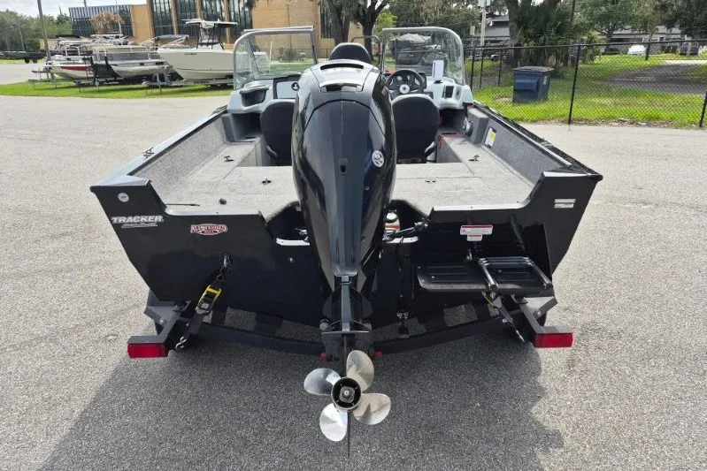 Slide: The Image of 2018 Tracker Pro Guide V-175 Combo boat, rear view with outboard motor. - 5