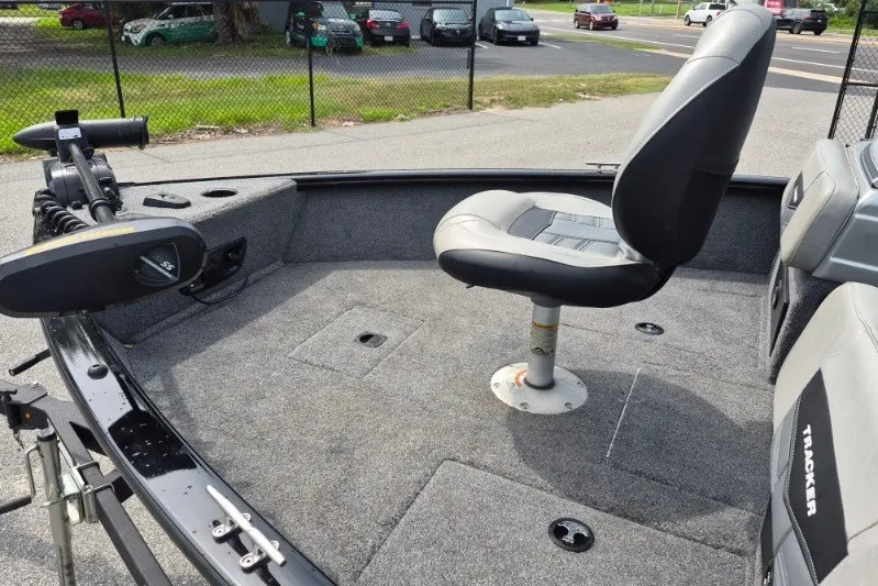 Slide: The Image of 2018 Tracker Pro Guide V-175 Combo boat interior with seating and trolling motor. - 12