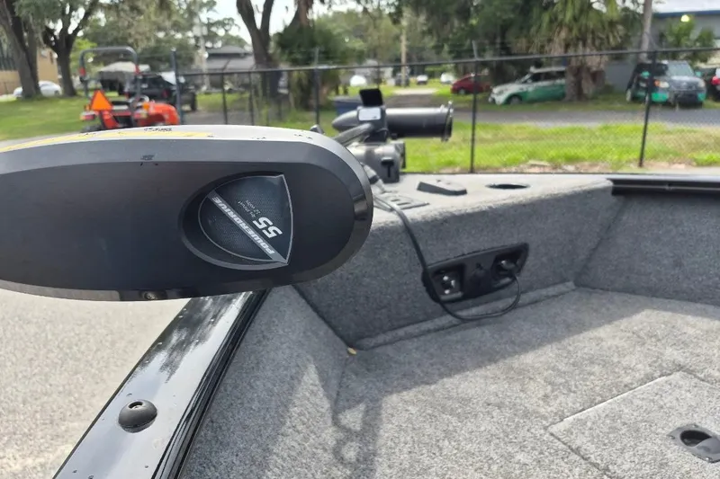 Slide: The Image of 2018 Tracker Pro Guide V-175 Combo boat interior with trolling motor and carpeted deck. - 11