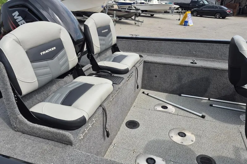 Slide: The Image of 2018 Tracker Pro Guide V-175 Combo boat interior with seating and fishing rod holders. - 8