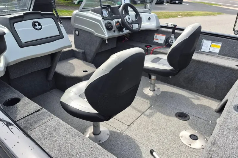 Slide: The Image of 2018 Tracker Pro Guide V-175 Combo boat interior with dual seats and steering console. - 14