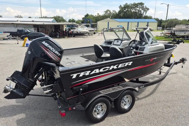 Slide: The Image of 2018 Tracker Pro Guide V-175 Combo boat with Mercury engine on trailer. - 4