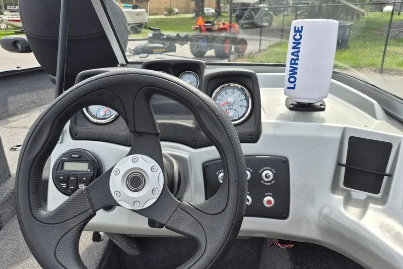 Slide: The Image of Steering console of 2018 Tracker Pro Guide V-175 Combo boat with Lowrance device. - 16