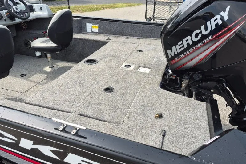Slide: The Image of 2018 Tracker Pro Guide V-175 Combo boat interior with Mercury FourStroke engine. - 7