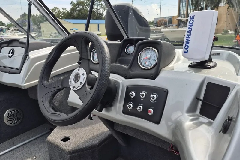 Slide: The Image of 2018 Tracker Pro Guide V-175 Combo boat dashboard with steering wheel and Lowrance device. - 15