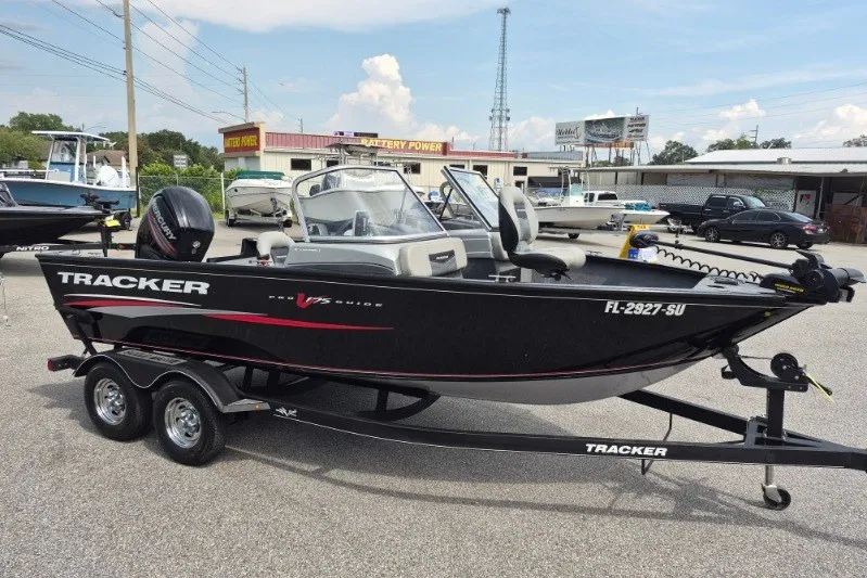 Slide: The Image of 2018 Tracker Pro Guide V-175 Combo boat on trailer in outdoor dealership lot. - 3
