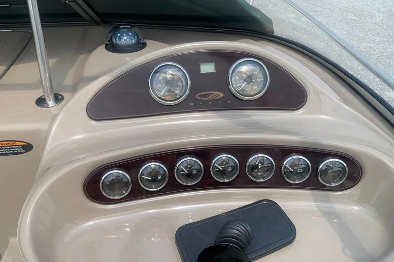 Slide: The Image of Dashboard of a 2000 Maxum 2300 SC boat with gauges and controls. - 8