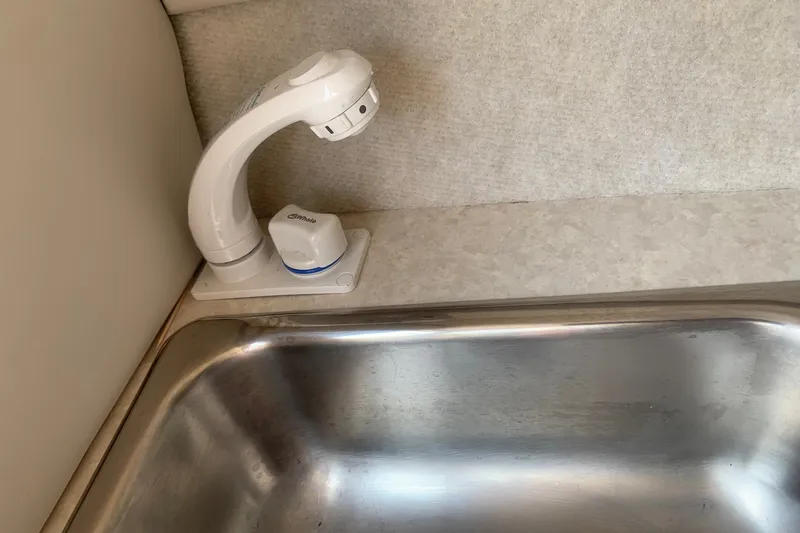 Slide: The Image of Boat sink with white faucet in 2000 Maxum 2300 SC model. - 18