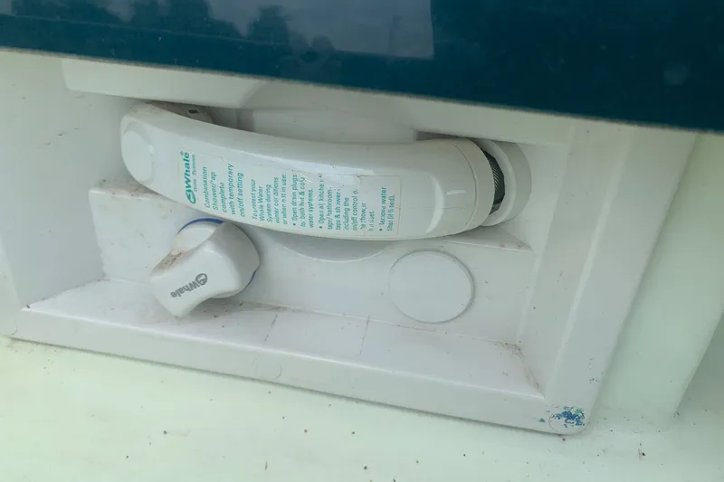 Slide: The Image of Boat shower control panel on a 2000 Maxum 2300 SC, featuring Whale brand components. - 21