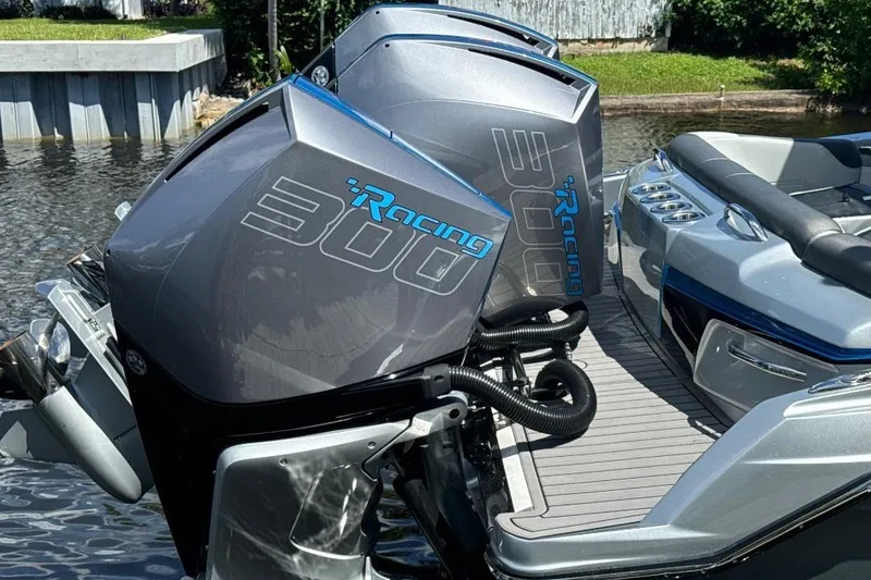 Slide: The Image of 2024 Nor-Tech 340 Sport boat with twin 300 Racing outboard engines on water. - 4