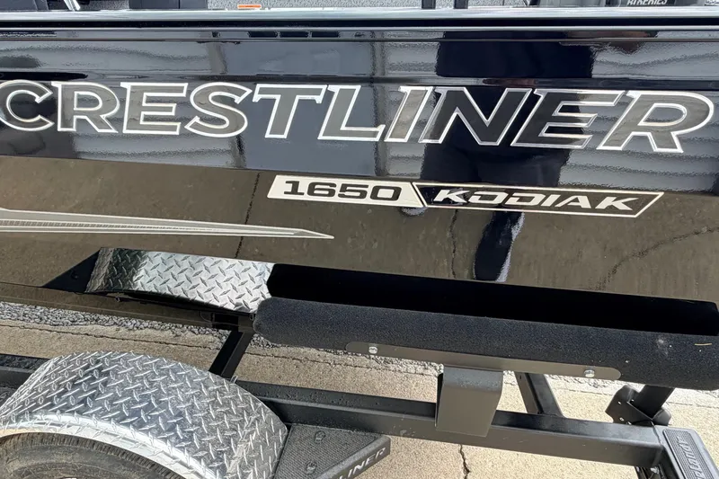 Slide: The Image of Crestliner 1650 Kodiak SC 2027 boat on trailer, showcasing model branding. - 7