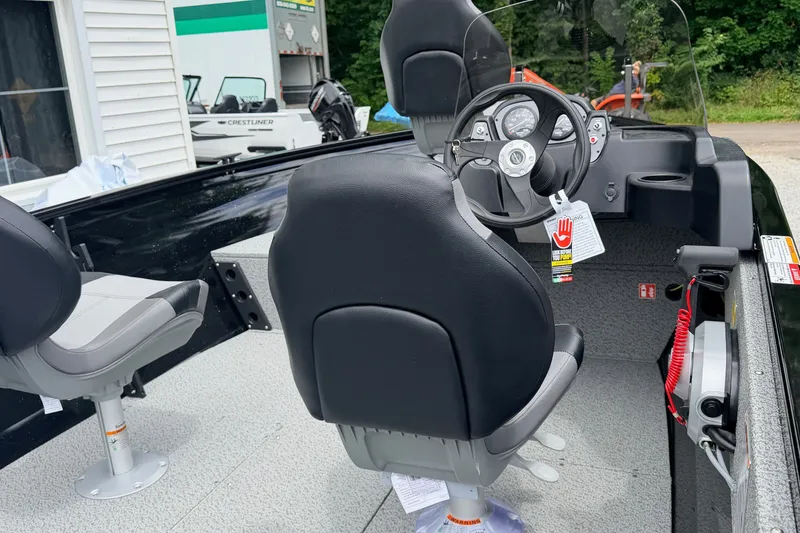 Slide: The Image of Interior of 2027 Crestliner 1650 Kodiak SC boat with steering console and seating. - 5