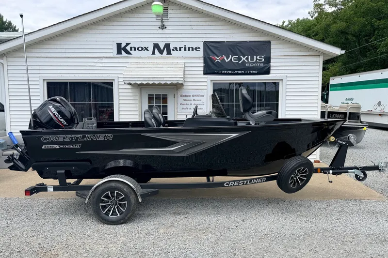 Slide: The Image of 2027 Crestliner 1650 Kodiak SC boat on trailer outside Knox Marine dealership. - 9