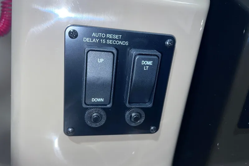 Slide: The Image of Control panel with "Up/Down" and "Dome Light" switches in a 2026 Sylvan X3. - 28