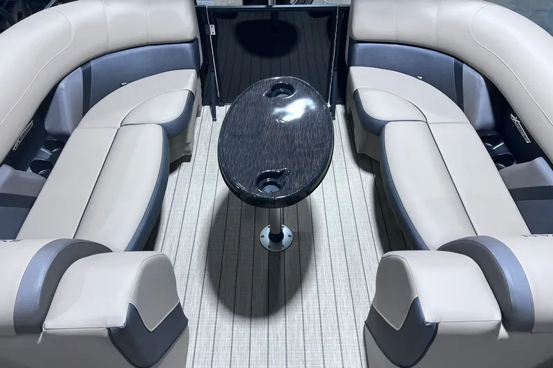 Slide: The Image of Luxurious interior of 2026 Sylvan X3 boat with elegant seating and sleek table design. - 13
